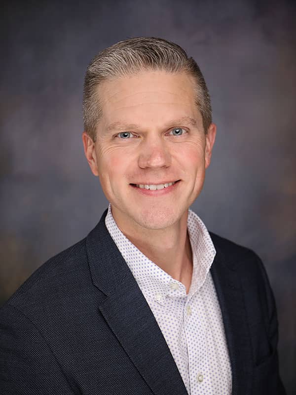 Travis Colquett's headshot